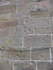 The bullet holes in Ripley Castle Gatehouse