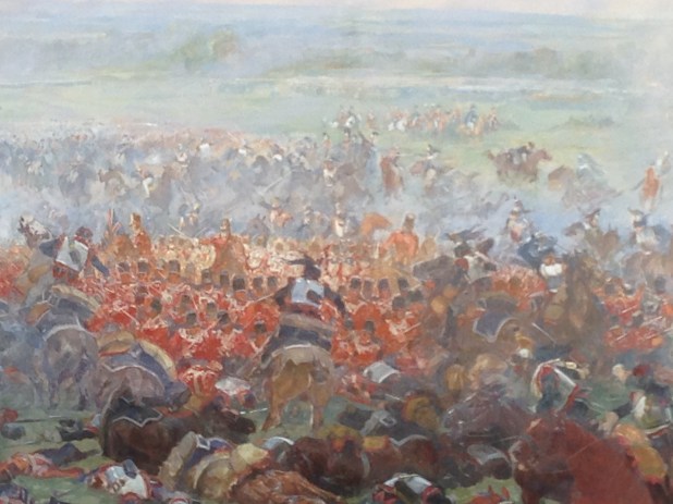 A picture of a painting of a square and the charge against it from The Lion Mount on the battle site