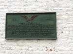 The plaque which commemorates the end of this terrible battle
